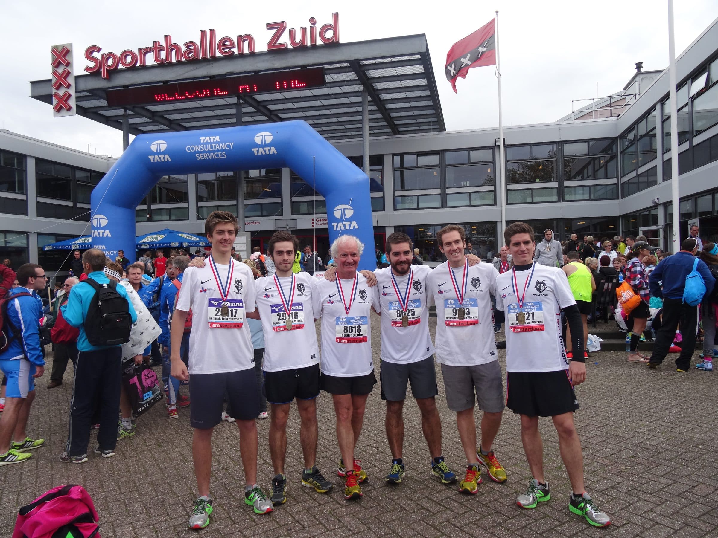 The six runners with their medals after the Amsterdam race.